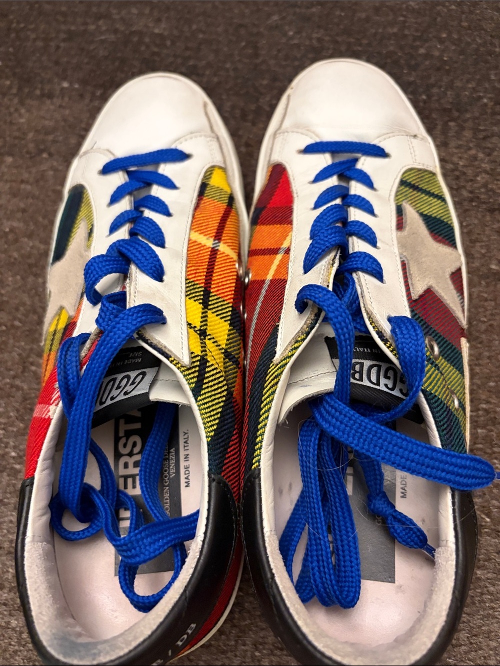 Golden Goose sneakers with black soles and multicolor tartan sides